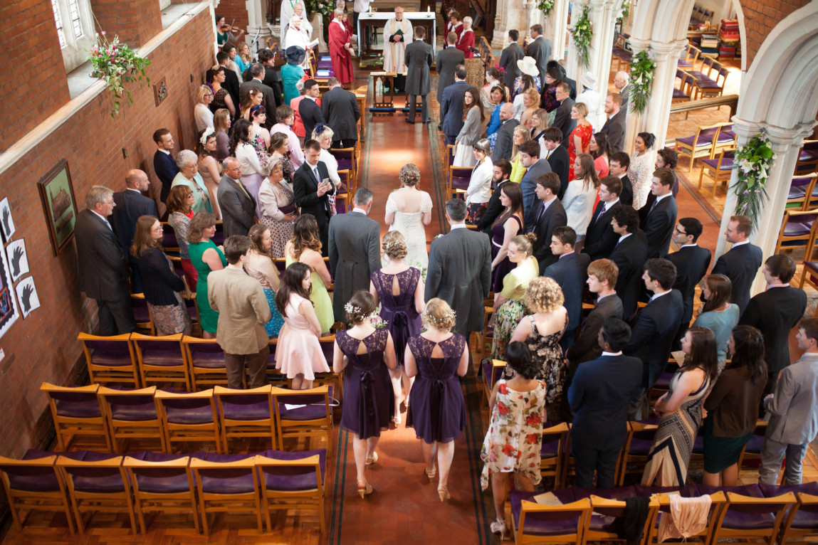 Bride and bridal party enter church